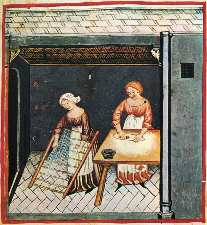 Ilustração de duas mulheres trabalhando em um cozinha, vestidas com um traje gótico medieval simples