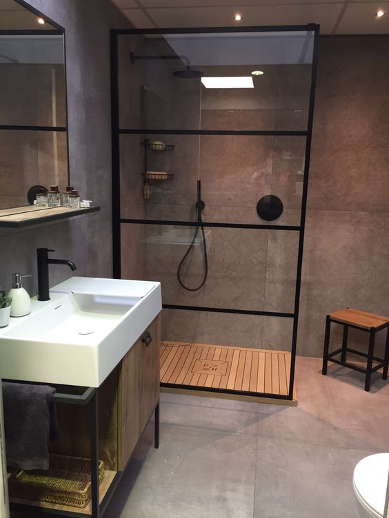 Banheiro cinza e preto. Banheiro com decoração industrial