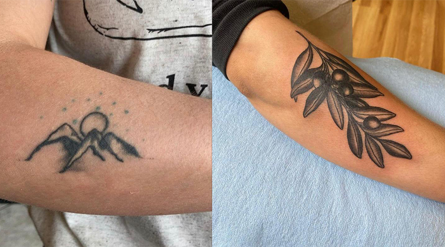 Tatuagem antiga de um sol saindo atrás de montanhas. A segunda imagem é da cobertura dessa tatuagem: um ramo de folhas e frutos pretos.