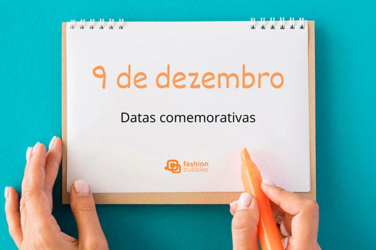 Foto de prancheta com fundo azul e escrito "9 de dezembro" laranja