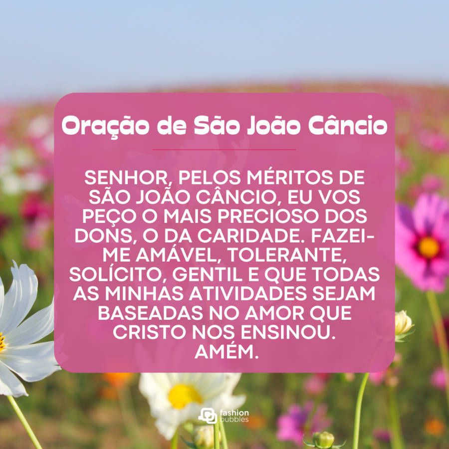 Foto de campo florido com a oração de são joão câncio em destaque, em rosa