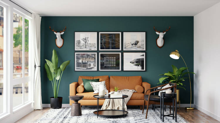 sala com parede verde, plantas, sofá marrom e composição de quadros sala com parede verde, tendências de arquitetura