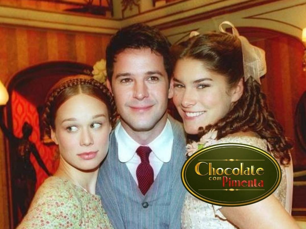 Foto da Mariana Ximenes, Murilio Benício e Priscila Fantin abraçados em cena da novela Chocolate com Pimenta.