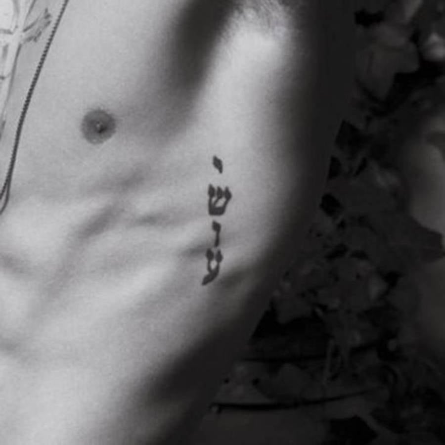 Foto da tatuagem de Justin Bieber que significa Yeshua