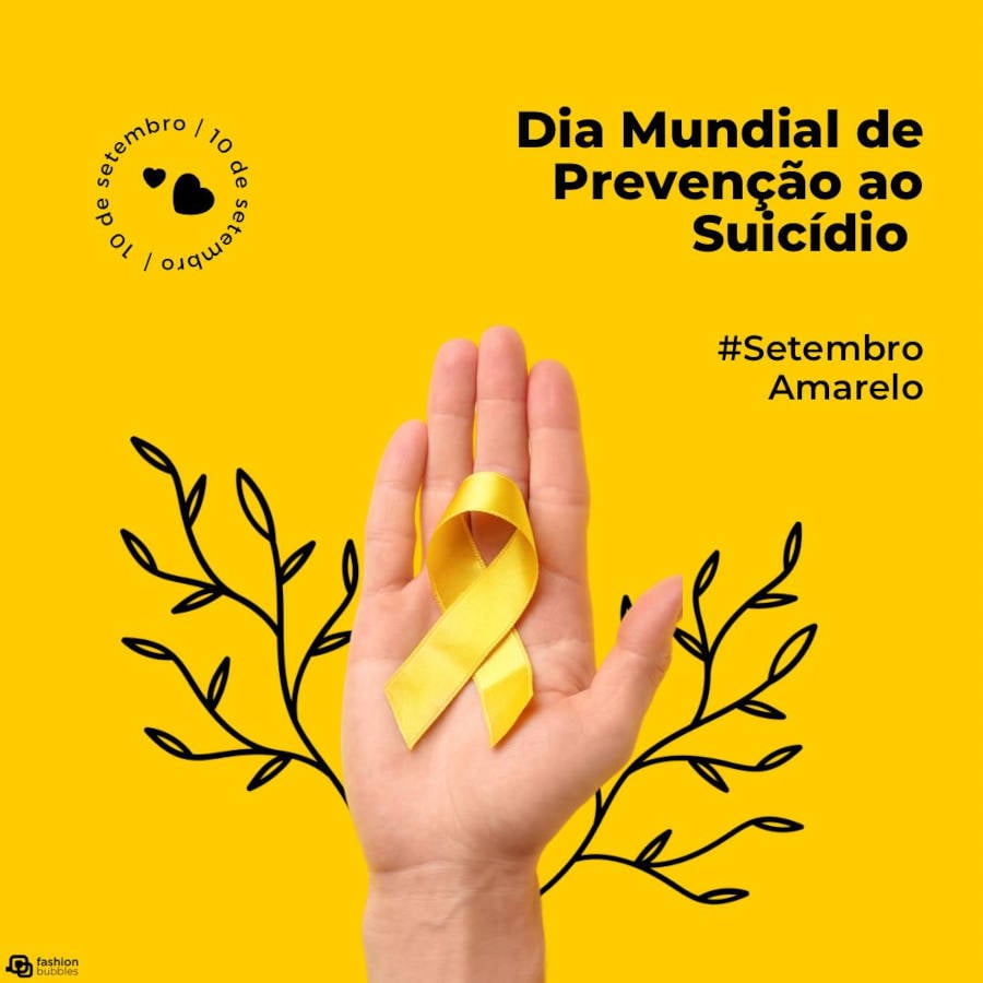 Foto de mão segurando fita amarela em homenagem ao Dia Mundial de Prevenção ao Suicídio