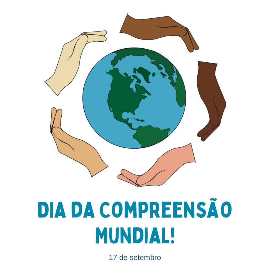 Foto de mãos segurando o mundo com destaque na frase Dia da Compreensão Mundial