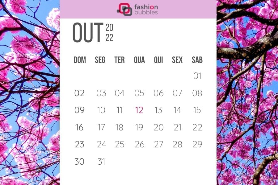 calendário de outubro de 2022 com foto de fundo de ipê rosa florido e céu azul