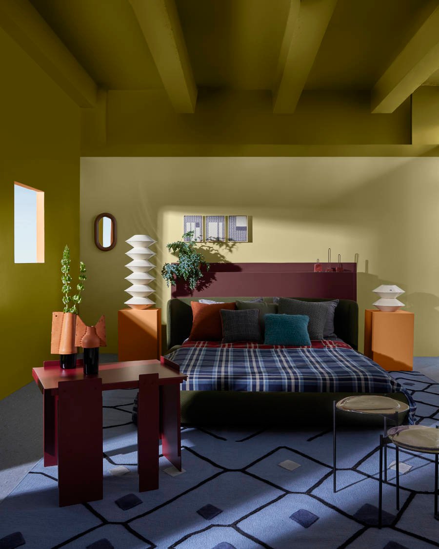 The double bedroom with green ceiling is one of Suvinil's signature colors.