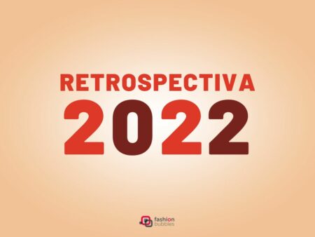 Imagem com fundo bege, no centro, escrito de laranja e marrom "Retrospectiva 2022". Abaixo, logo colorida do Fashion Bubbles.