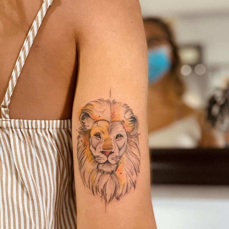 Tatuagem rosto de leão com ricos laranjas