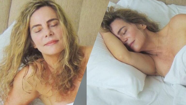 Bruna Lombardi posa nua na cama.