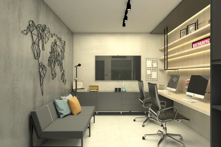 Parede cinza destacada em home office com escrivaninha, sofá-cama e televisão. A parede destacada apresenta um mapa mundi em preto e dá um contraste com as demais paredes que são mais claras. 