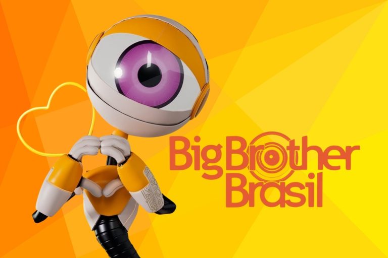 A imagem apresenta o famoso robô do Big Brother Brasil em destaque, com design amarelo e branco, um grande olho roxo central, formando um coração com as mãos. Ao fundo, tons de laranja e o logotipo do programa.