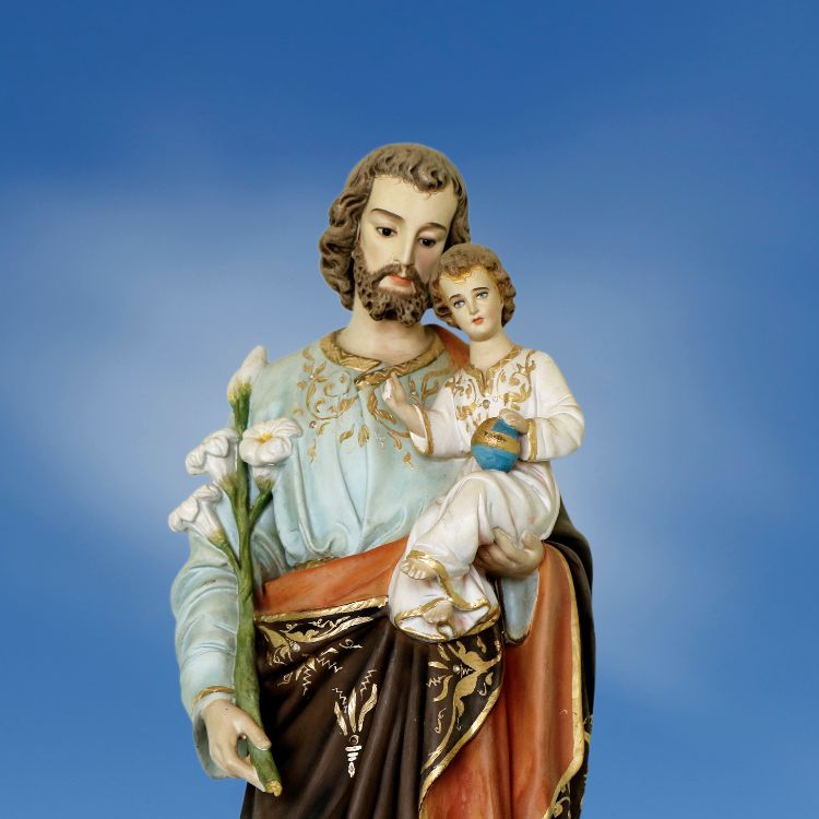Imagem do santo com Jesus no colo, em fundo azul.

