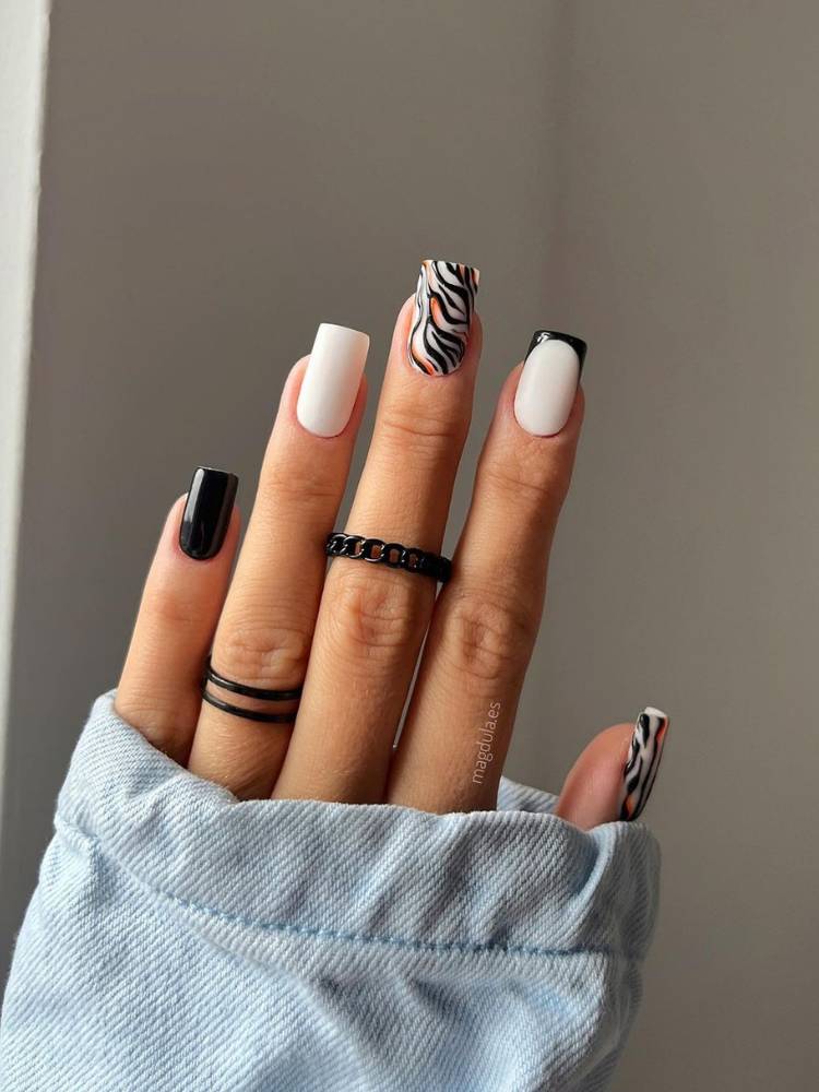 Unhas pretas, brancas e com nail art de zebra
