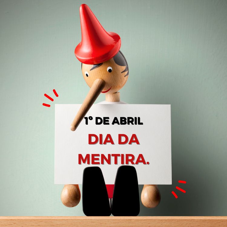 Boneco Pinóquio de madeira segurando placa escrito "1º de abril, dia da mentira"