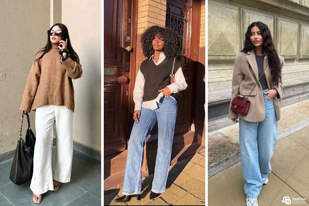 Três mulheres exibindo looks de frio modernos. A primeira veste um suéter marrom e calças brancas. A segunda usa colete de tricô sobre camisa branca e jeans wide leg. A terceira combina blazer bege, blusa preta e jeans wide leg.