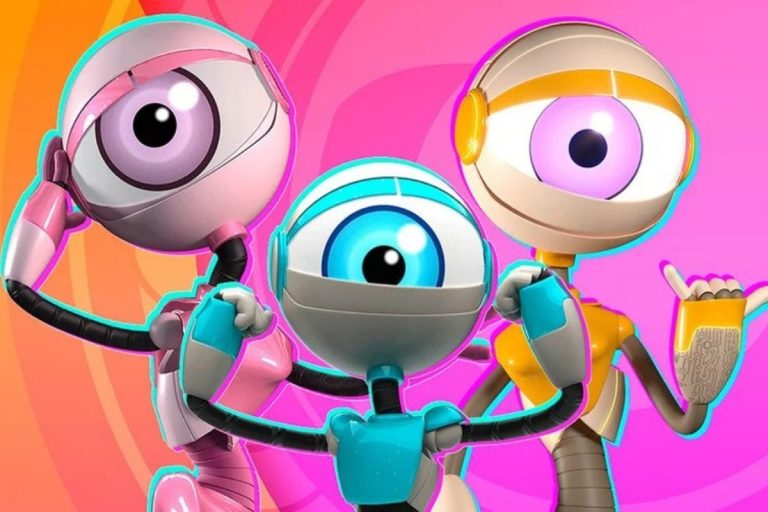 A imagem mostra três robôs coloridos do BBB com grandes olhos em destaque. Um é rosa, outro azul e o terceiro amarelo, todos sorrindo e em poses animadas, com fundo rosa vibrante. Personagens marcantes e futuristas.